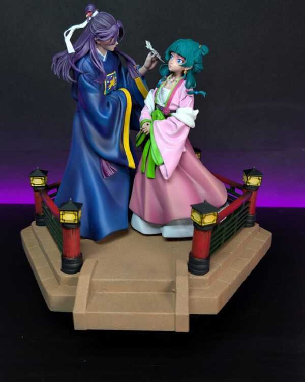 Hand-painted resin figures of Maomao and Jinshi finished at the atelier